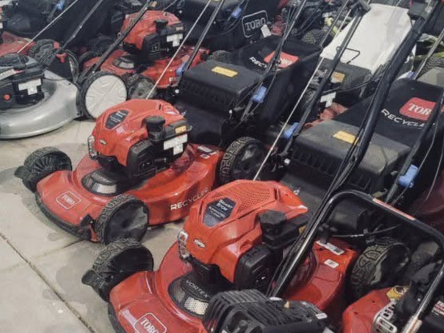 Row of mowers in for small-engine service at Cache Moto