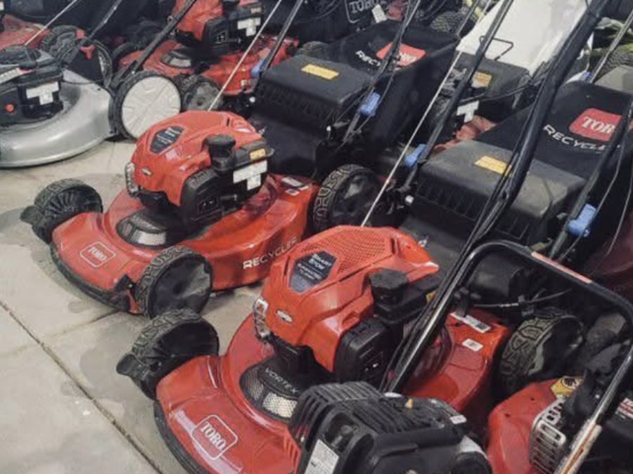 Row of mowers in for small-engine service at Cache Moto