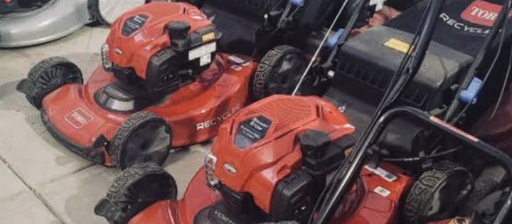 Row of mowers in for small-engine service at Cache Moto